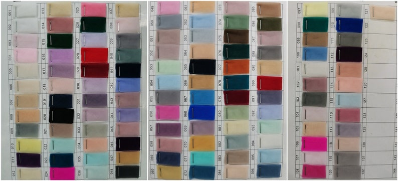 May include: A chart of 120 different colors of tulle fabric swatches. The swatches are arranged in rows and columns, and each swatch is labeled with a number.