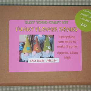 May include: A craft kit box with a pink label that says "Suzy Todd Craft Kit Funky Flower Gonks". The label also includes a picture of three felt gnomes with flower accents. The box is brown and has a green sticker that says "Contains Everything You Need £10".