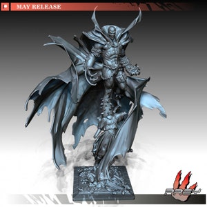 May include: A gray 3D printed figurine of the superhero Spawn, standing on a base with a smaller figure underneath. Spawn is wearing a cape and has a skull-like mask. The figurine is a collectible.