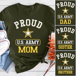 May include: Olive green t-shirt with the word "PROUD" in white block letters above a yellow star and the text "U.S. ARMY MOM" in a yellow rectangle. Additional shirts say "DAD", "SISTER", and "BROTHER".