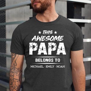 This Awesome Papa Belongs To Shirt, Custom Papa Gift, Grandpa T-Shirt with Grandkids’ Names, Father’s Day Gift, Personalized Papa Tee