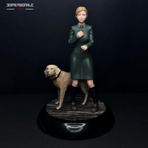 May include: A figurine featuring a person with light brown hair wearing a dark green dress and black knee-high socks, standing next to a tan dog with a dark collar. The base is circular and dark, with the text 3DIMENSIONALE visible in the top corner.