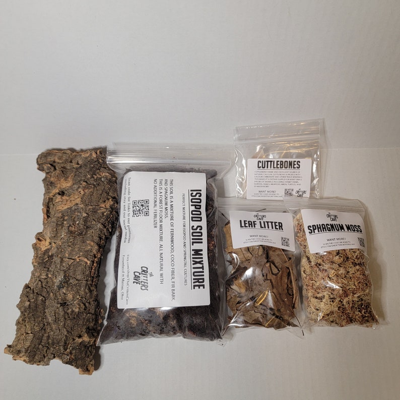 May include: A set of isopod terrarium supplies, including a bag of isopod soil mixture, a bag of leaf litter, a bag of sphagnum moss, a piece of cork bark, and a bag of cuttlebones. The bags are labeled with the name of the product and the brand "Critters Cave".