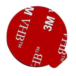 May include: A red, round adhesive sticker with the text "3M TM" and "HB TM" in white.