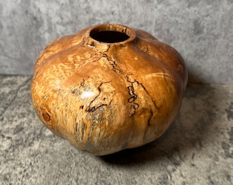 Hollow form hand carved vase