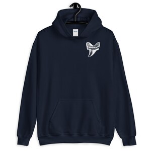 May include: A navy blue hoodie with a white graphic of a large tooth on the front.