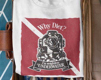 May include: White sweatshirt with a red and white scuba diving flag design. The design features a vintage diving helmet with the text "Why Diet? I'm weightless UNDERWATER".