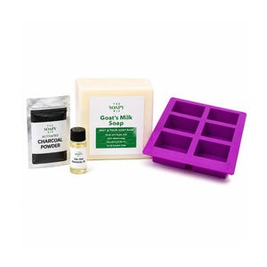 May include: A soap-making kit with a large block of Goat's Milk Soap, a packet of Activated Charcoal Powder, a small bottle of Tea Tree Essential Oil, and a purple silicone mold with six rectangular cavities. The kit is designed for making soap.