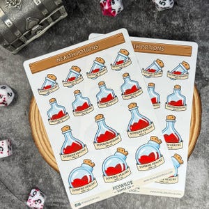 May include: Two sticker sheets featuring illustrated health potions with labels like "Potion of Healing" and "Supreme Healing." The stickers have a fantasy theme, with red liquid in glass bottles. The text "Feywild Supply Co" is also visible.