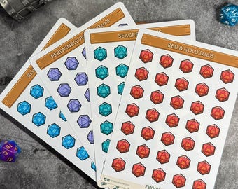 May include: Four sticker sheets with colorful d20 dice designs. The sheets are labeled "BLU", "PERIWINKLE PV", "SEAGRE", and "RED & GOLD D20'S". The stickers feature blue, purple, teal, and red dice. The Feywild Supply Co. logo is visible.