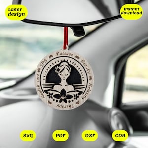 May include: A wooden spa-themed car charm with a red string for hanging. The charm features a woman's silhouette and the words "Health care, Spa, Massage, Beauty, Relaxing, Therapy." The charm is hanging from a car's rearview mirror.