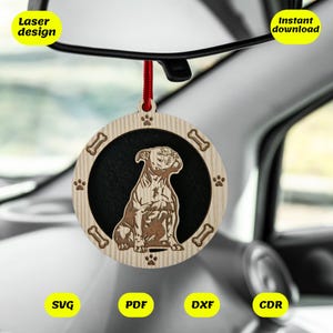 May include: A wooden car air freshener with a laser cut design of a sitting American Bulldog. The air freshener is round and has a red string for hanging. The text "Laser design" and "Instant download" is visible in the image.
