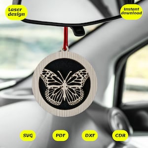 May include: A wooden car air freshener with a black and white butterfly design. The air freshener is hanging from a rearview mirror in a car. The text "Instant download" is visible in the upper right corner of the image. The text "SVG, PDF, DXF, CDR" is visible in the lower part of the image.