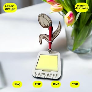 May include: Laser cut wooden notepad holder with a tulip design and a pen holder. The holder has a sticky note pad and the text "Thank you Mom" is engraved on the tulip stem.