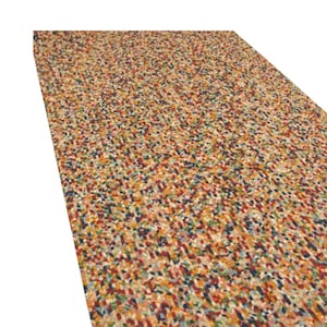 May include: A rectangular rug with a speckled pattern. The rug features a mix of colors, including red, blue, green, yellow, and brown. The design is made up of small, irregular shapes, creating a textured appearance.