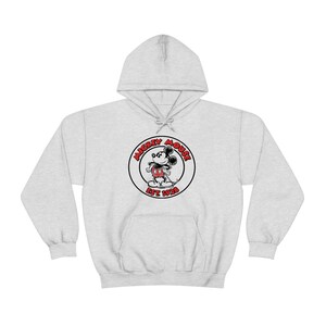 May include: A grey hooded sweatshirt with a black and white image of Mickey Mouse in a red circle with the text "Mickey Mouse Est 1928".