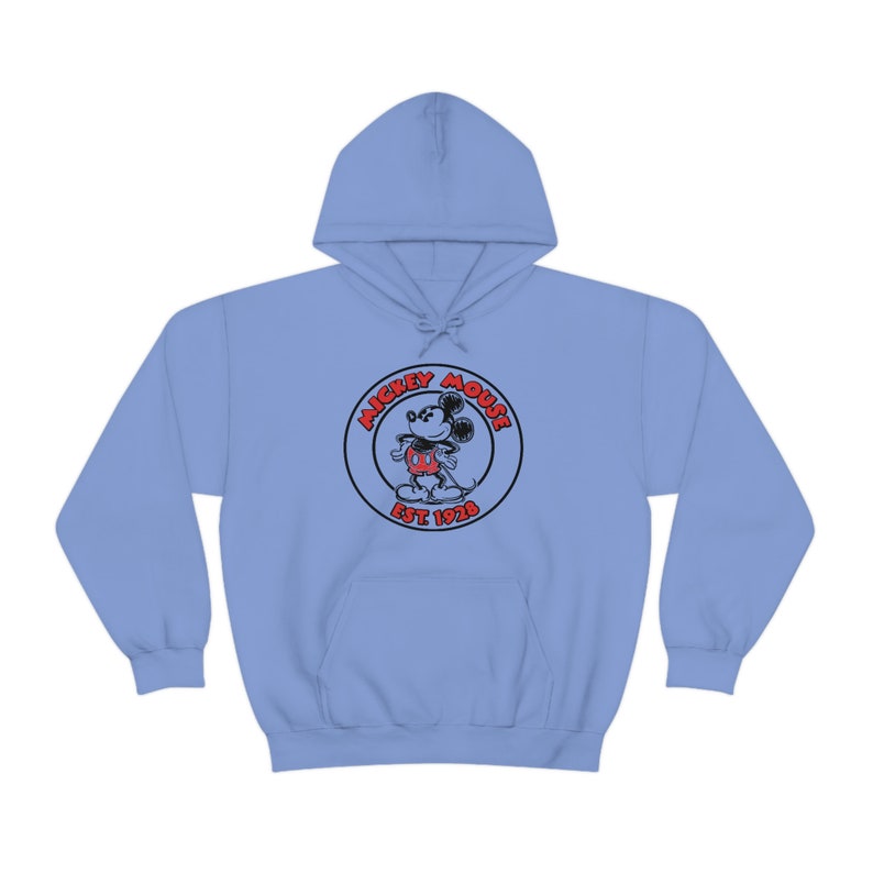 May include: Light blue hooded sweatshirt with a black and red Mickey Mouse logo. The logo features Mickey Mouse in a circle with the text "Mickey Mouse Est 1928".