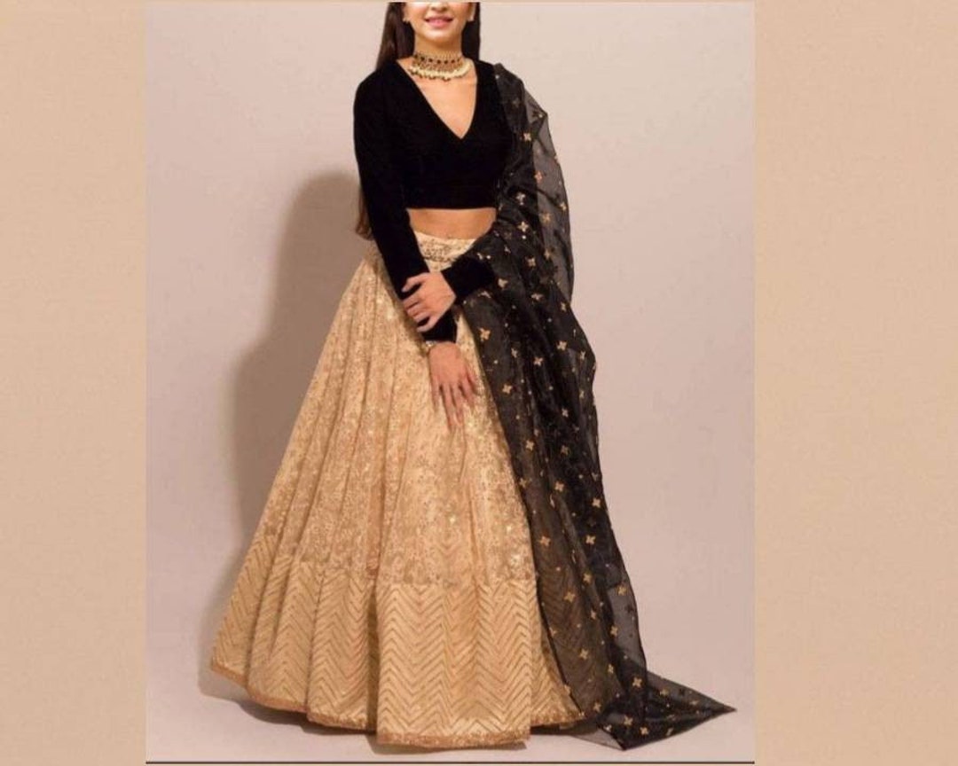 white lehenga with black blouse