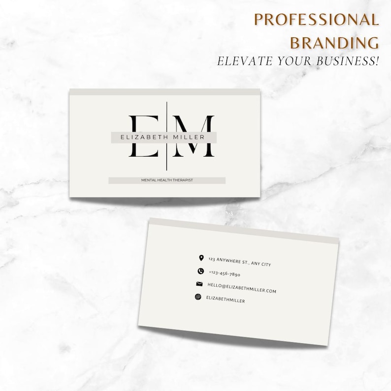 May include: A white business card with black text. The front of the card features the initials "EM" in a large font, with the name "Elizabeth Miller" and the title "Mental Health Therapist" in a smaller font. The back of the card has contact information, including an address, phone number, email address, and website.