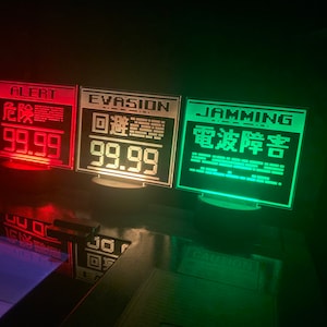 May include: Three illuminated signs with red, white, and green lights. The signs read "ALERT 99.99", "EVASION 99.99", and "JAMMING 電波障害".