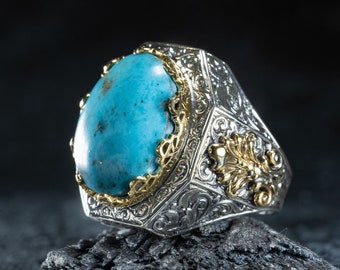 May include: A silver ring with an ornate design and a turquoise stone set in the center.