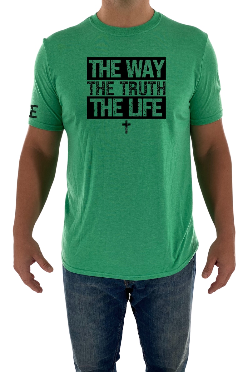 May include: A green t-shirt with a black box that says "THE WAY THE TRUTH THE LIFE" with a cross underneath.