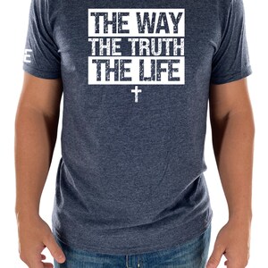 May include: A navy blue t-shirt with a white distressed graphic that reads "THE WAY THE TRUTH THE LIFE" with a white cross underneath.