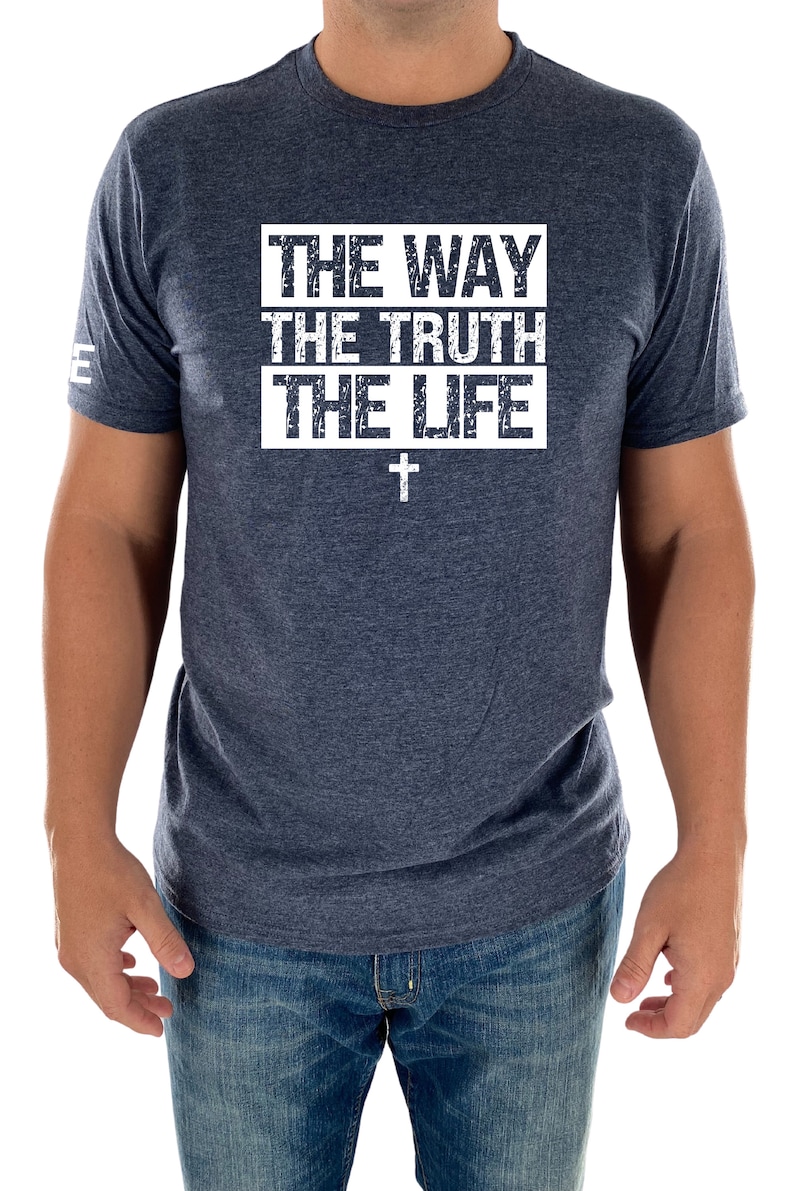 May include: A navy blue t-shirt with a white distressed graphic that reads "THE WAY THE TRUTH THE LIFE" with a white cross underneath.
