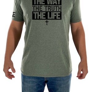May include: A green t-shirt with a black graphic that says "THE WAY THE TRUTH THE LIFE" with a cross underneath.