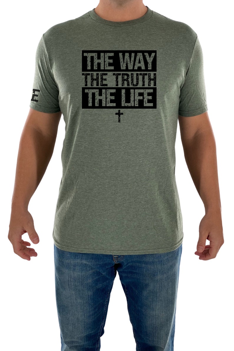May include: A green t-shirt with a black graphic that says "THE WAY THE TRUTH THE LIFE" with a cross underneath.