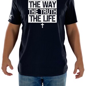 May include: A black t-shirt with a white graphic that says "THE WAY THE TRUTH THE LIFE" with a white cross underneath.