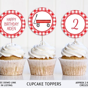 May include: Red and white gingham cupcake toppers with a red wagon, the number 2, and the text "Happy Birthday Aiden". The toppers are approximately 2 inches in diameter.
