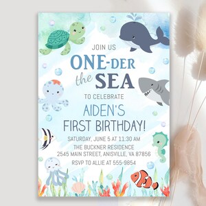 May include: A blue and white invitation with the text "ONE-DER the SEA" and "AIDEN'S FIRST BIRTHDAY!" features cartoon sea creatures like a whale, shark, and turtle. The invitation includes event details.