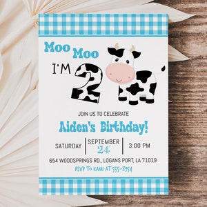 May include: A blue and white gingham birthday invitation featuring a cartoon cow and the text "Moo Moo I'm 2". The invitation is for Aiden's birthday party on 24th September at 3:00 PM. The address is 654 Woodsprings Rd., Logans Port, LA 71019. The RSVP information is "RSVP to Kami at 555-8954".
