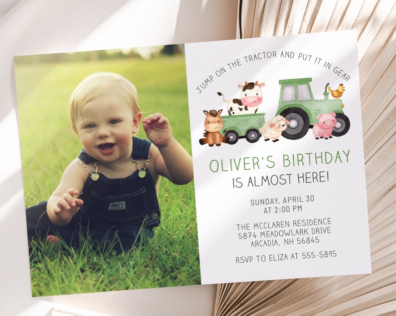 May include: A birthday invitation featuring a smiling toddler in denim overalls sitting in green grass. The invitation includes a watercolor illustration of a green tractor pulling a cart with farm animals and the text "Oliver's Birthday is Almost Here!"