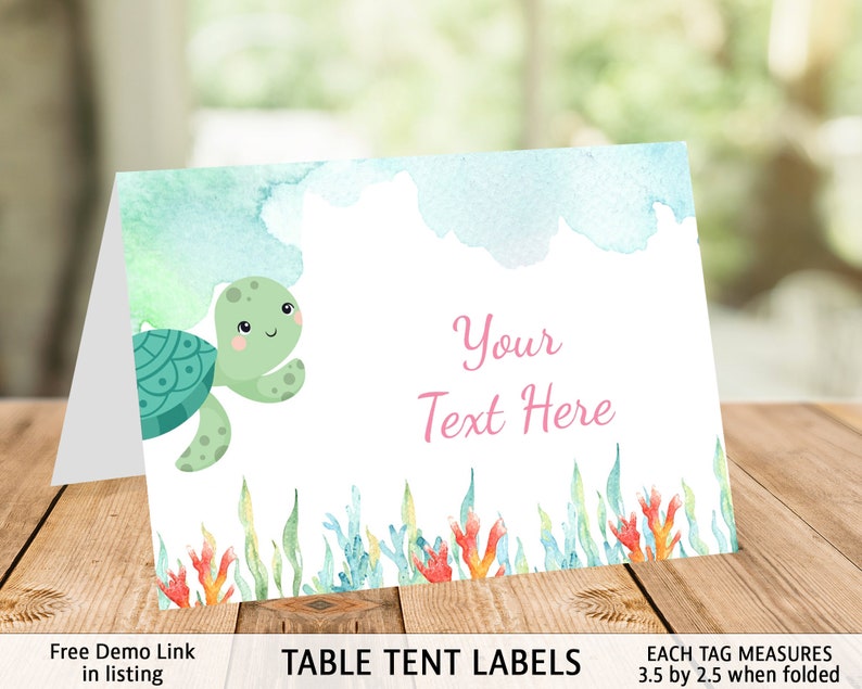 May include: Table tent labels with a watercolor background featuring a green sea turtle with a pink shell and coral. The text "Your Text Here" is written in pink. Each tag measures 3.5 inches by 2.5 inches when folded.