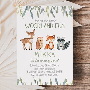 May include: A woodland-themed invitation with watercolor illustrations of a deer, owl, fox, and raccoon. The text reads "Join us for some WOODLAND FUN" and "MIKKA is turning one!" with event details. Green foliage accents the top and bottom.
