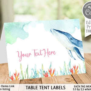 May include: A watercolour table tent label featuring a blue whale swimming through turquoise and green water. The text "Your Text Here" is in pink font. The label measures 3.5 inches by 2.5 inches when folded.