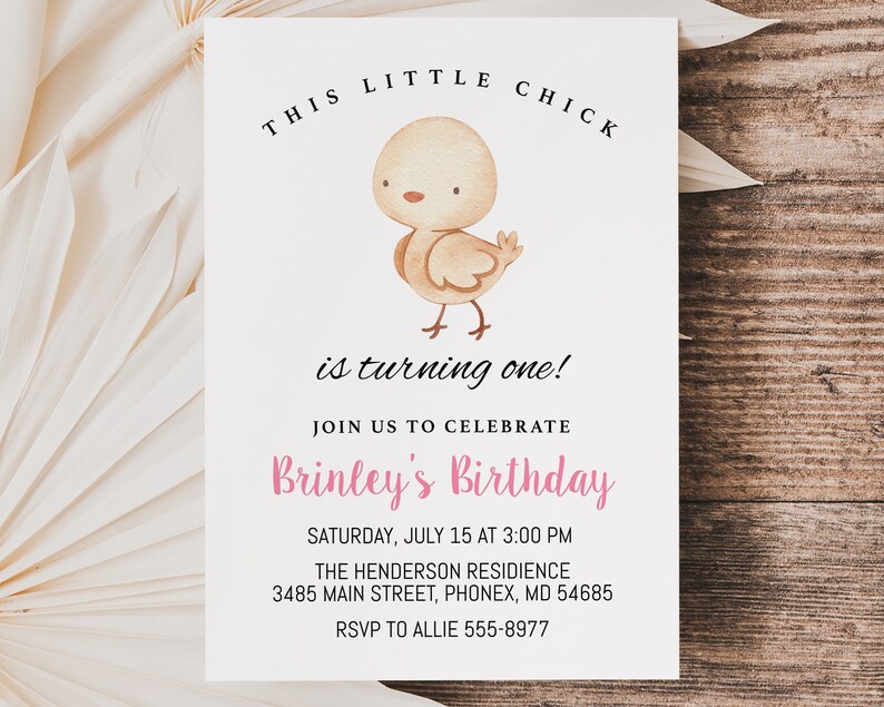 May include: A white invitation card with a cartoon illustration of a yellow chick. The text on the card reads "This Little Chick is turning one!" and includes details for a birthday party.