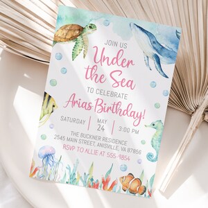 May include: Under the Sea themed birthday party invitation with watercolor illustrations of a whale, sea turtle, seahorse, jellyfish, and clownfish. The invitation includes the text "Join us Under the Sea to celebrate Arias Birthday!" with the date and time of the party.