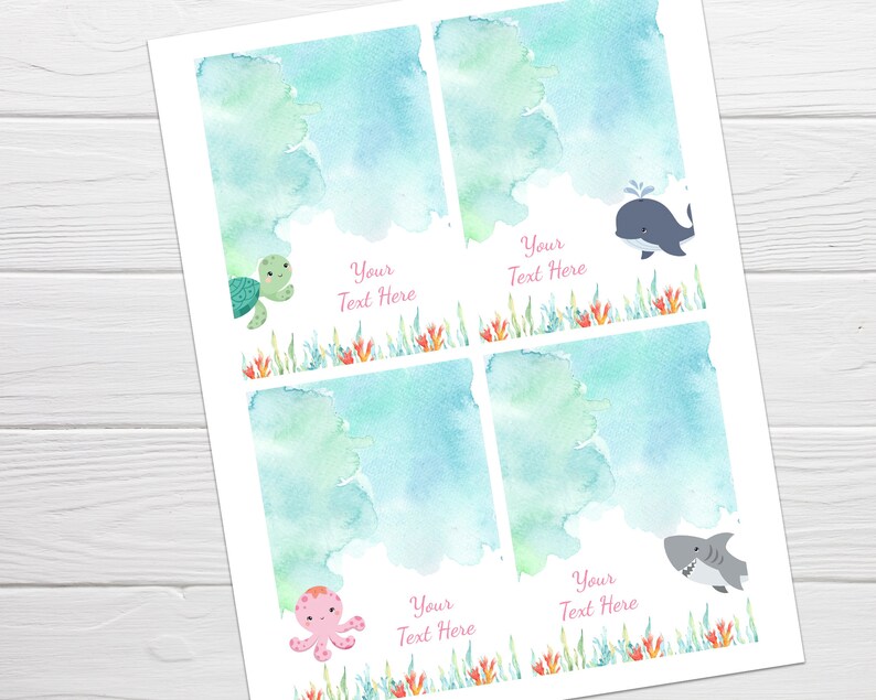 May include: Four printable favor tags featuring watercolor backgrounds with sea creatures. The tags include a turtle, whale, octopus, and shark. Each tag has the text "Your Text Here" in pink.