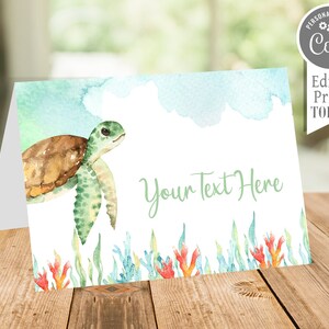 May include: A folded card featuring a watercolor illustration of a sea turtle. The turtle is brown and green, with a light blue and green watercolor background. The card includes the text "Your Text Here" and "Personalize with Corjl! Edit & Print TODAY!"