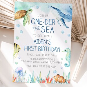May include: A blue and white watercolor invitation for a first birthday party with the text "Join us One-Der the Sea to celebrate Aiden's First Birthday!"  The invitation features a whale, a sea turtle, a seahorse, a jellyfish, and a clownfish.