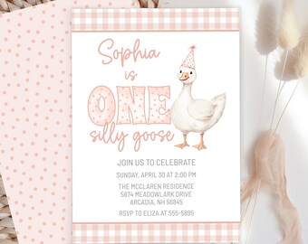 May include: A light pink and white invitation card with the text "Sophia is ONE silly goose". The card features a watercolor illustration of a goose wearing a party hat. The invitation is for a birthday party.