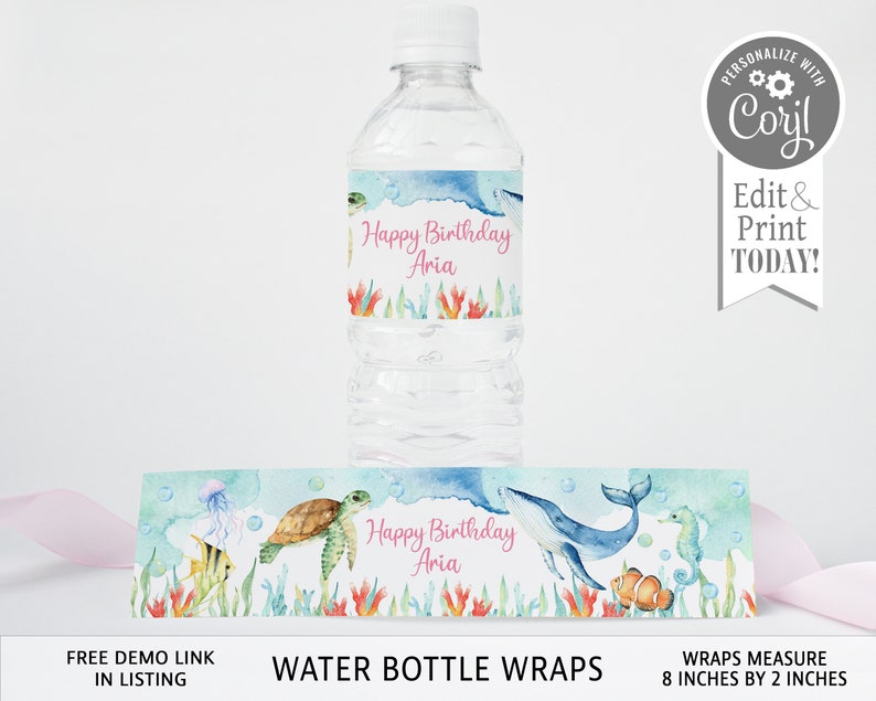 May include: Water bottle labels with an under the sea theme. The labels feature a whale, seahorse, turtle, and coral. The text on the labels reads "Happy Birthday Aria". The labels measure 8 inches by 2 inches.
