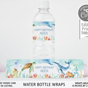 May include: Water bottle labels with a watercolor design featuring a whale, turtle, seahorse, and jellyfish. The labels say "Happy Birthday Aiden". The labels are 8 inches by 2 inches.