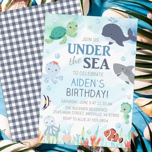May include: A blue and white checkered background with a light blue invitation card featuring a watercolor illustration of sea creatures. The text on the card reads "Join us Under the Sea to celebrate Aiden's Birthday! Saturday, June 5 at 11:30 AM The Buckner Residence 2545 Main Street, Anisville, VA 87856 RSVP to Allie at 555-9854".