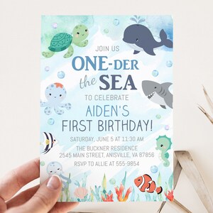May include: A colorful invitation with an underwater theme. The text reads "ONE-DER the SEA" to celebrate Aiden's first birthday. Features illustrations of sea creatures like a whale, shark, and octopus. Includes event details.