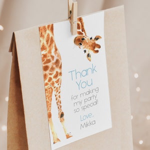 May include: A white thank you card with a giraffe illustration. The text on the card reads "Thank You for making my party so special! Love, Mikka".