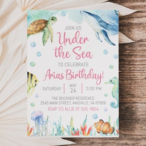 May include: Under the Sea birthday party invitation with a watercolor illustration of a whale, sea turtle, seahorse, jellyfish, and clownfish. The invitation includes the text "Join us Under the Sea to celebrate Arias Birthday!" with the date and time of the party.